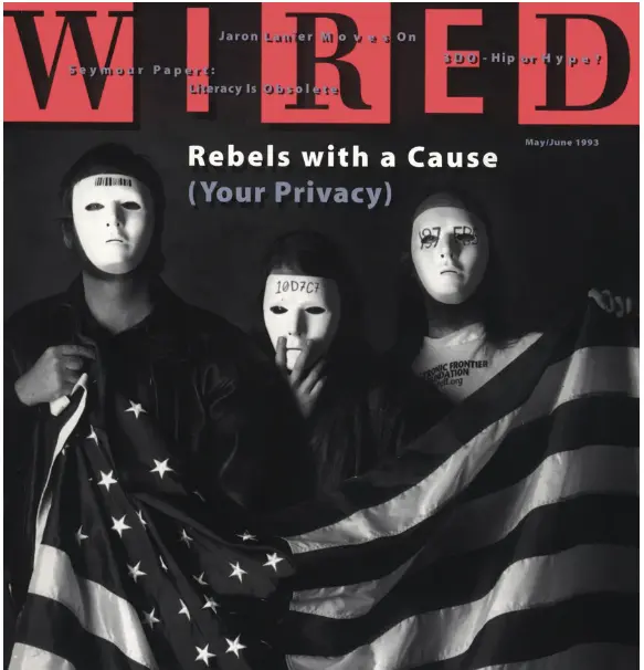 The cover of a Wired Magazine. Title "Rebels with a cause (Your privacy) Three persons wearing masks with cryptic writings on them, holding up the flag of the USA