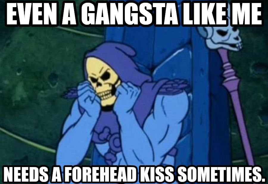 Skeletor seated in throne at a table with their head resting in their hands. The text says: "Even a gangsta like me needs a forehead kiss sometimes.