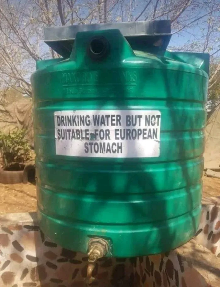 A water container with a label that says "Drinking water but not suitable for European stomach"