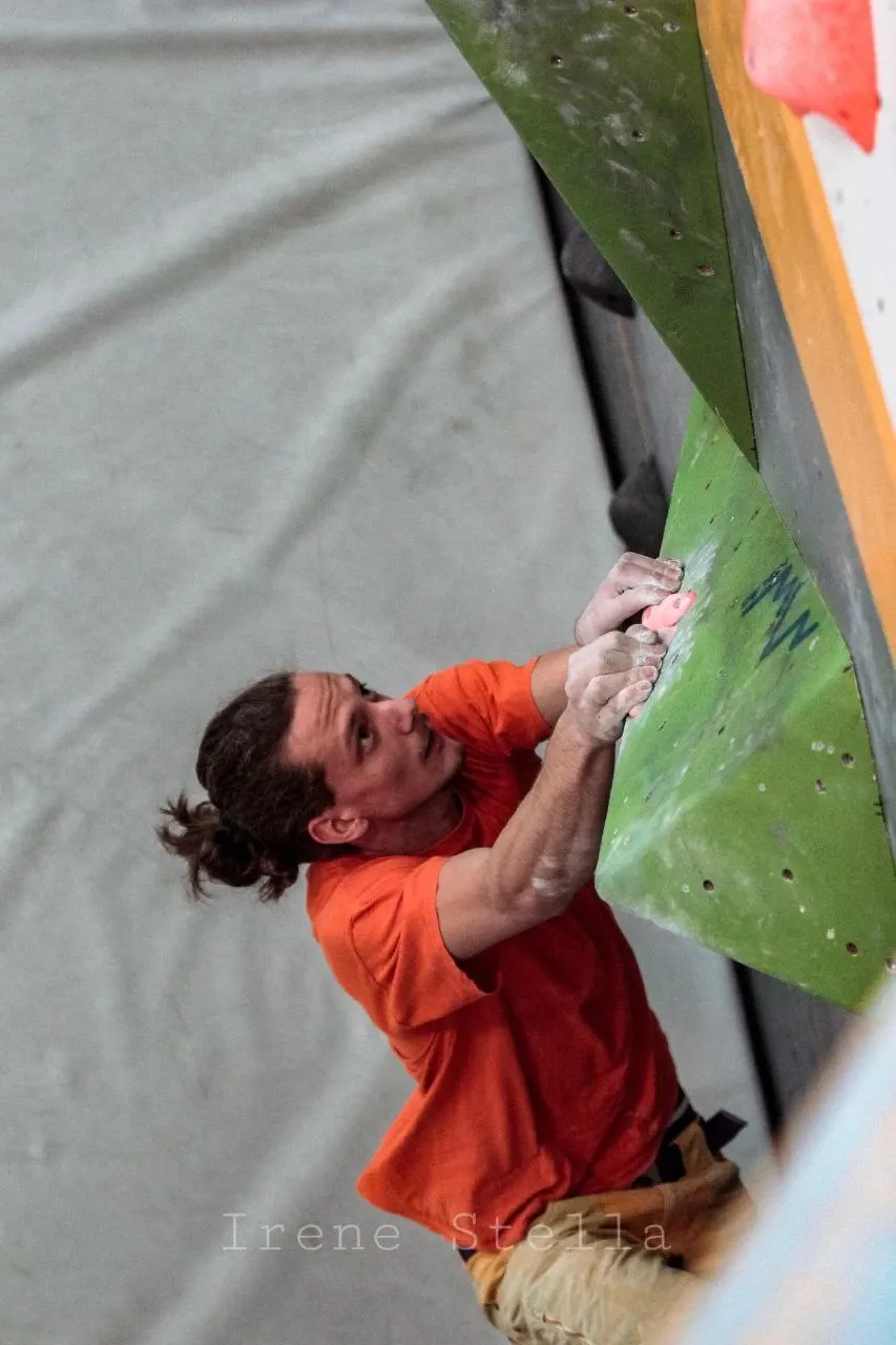 A wild Matteo Cristino, climbing a wall. Photo by Irene Stella