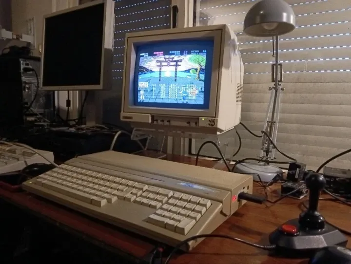 An old Atari with a joystick on a desk. it runs a kung-fu game. via: fierman